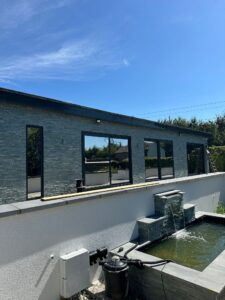 Exterior view of Farnham building with mirror window film