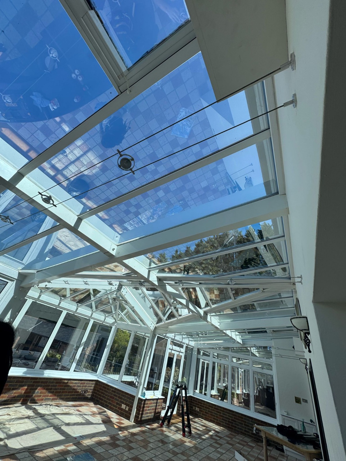 Security window film applied to large windows in Epsom house